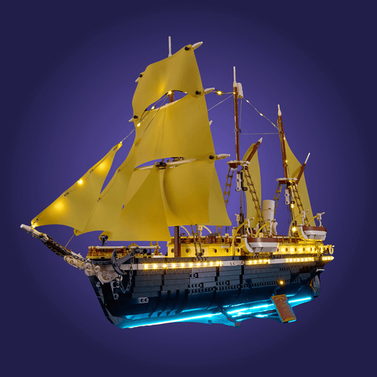 Lego set 10335 ship with yellow sails against a dark blue background