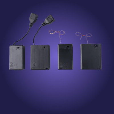 Set of electronic components including batteries, connectors, and wires on a blue background