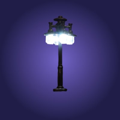 Model street lamp with lights on a purple background