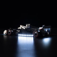 Model race car with illuminated undercarriage on a dark background