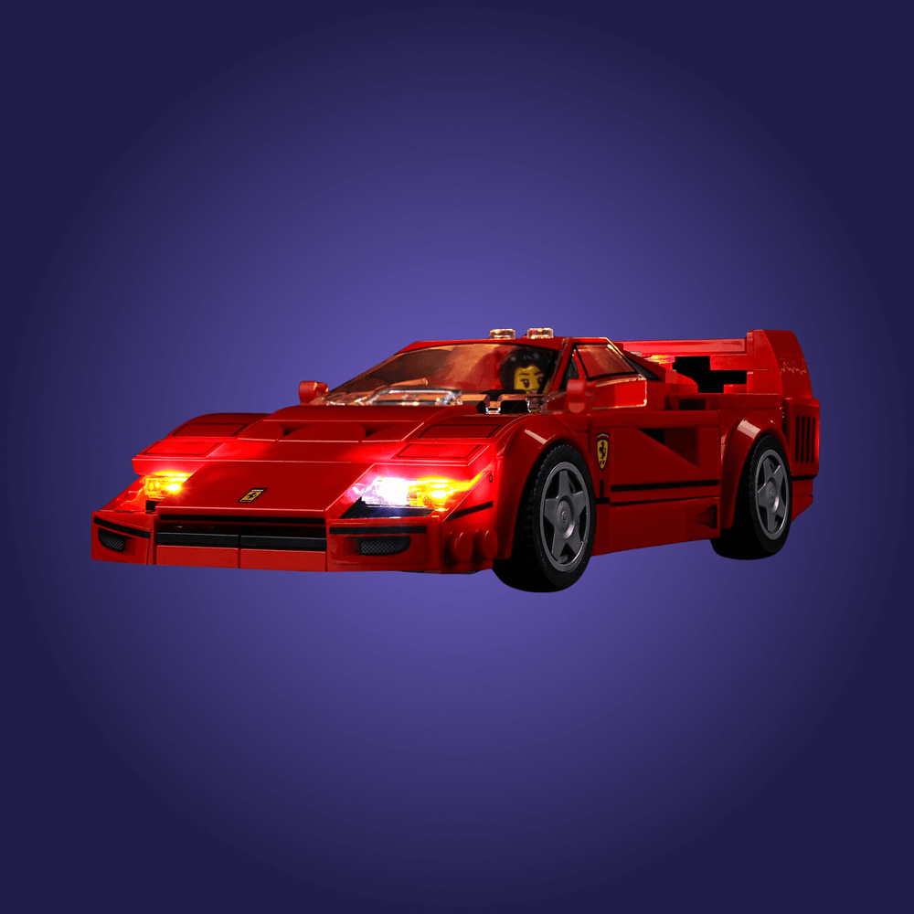 Red toy car with a Ferrari logo on a dark blue background