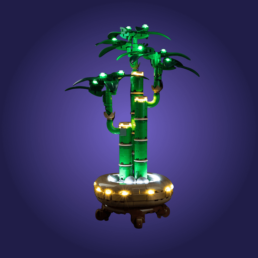 Decorative LED light on a Lego bamboo plant set 10344 on a dark purple background