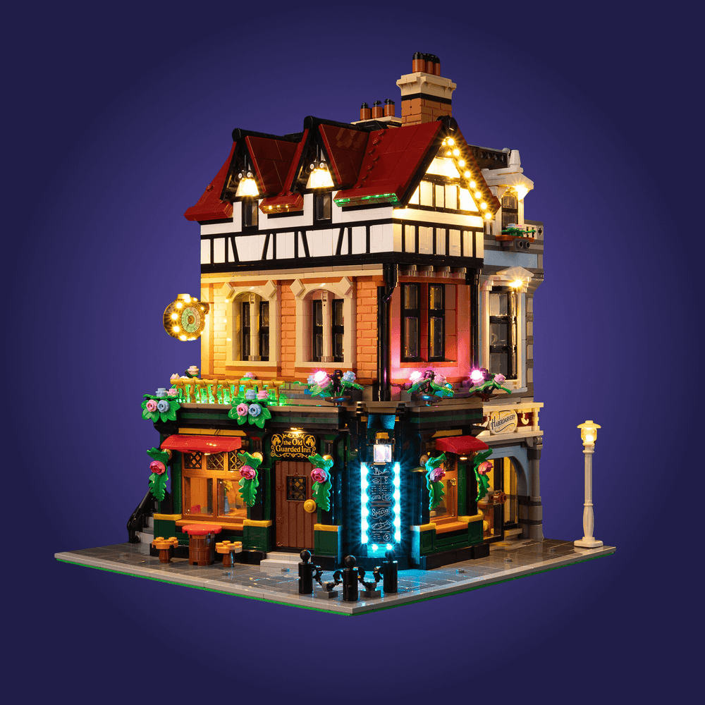 Detailed model of a Lego building 10350 with illuminated lights on a dark blue background