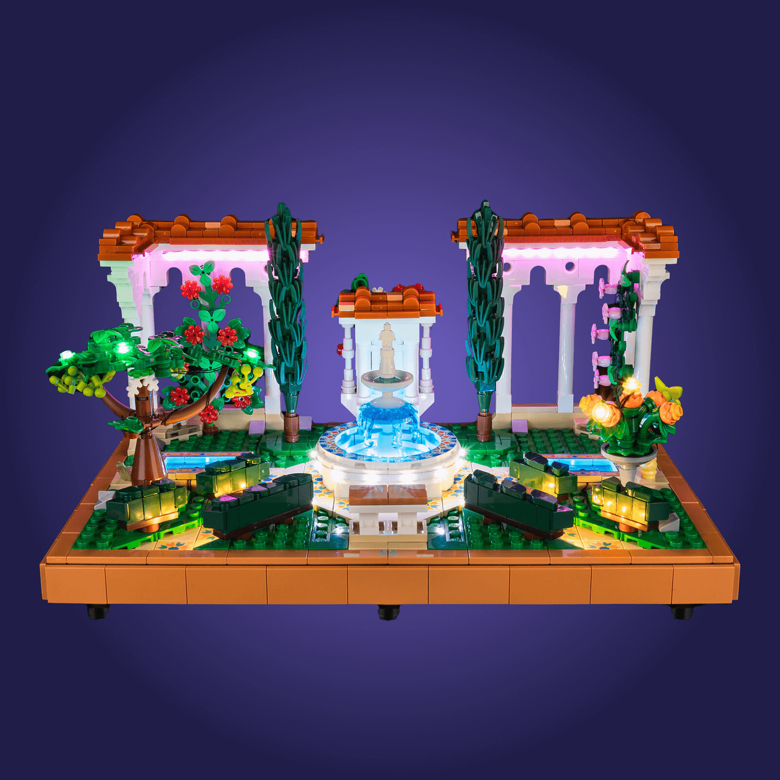 LEGO 10359 garden scene with fountain, trees, and flowers on a purple background