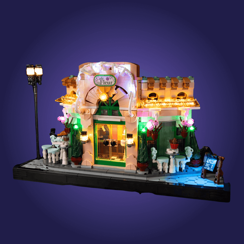 Light-up LEGO model of a quaint store 10362 with decorative elements on a dark background