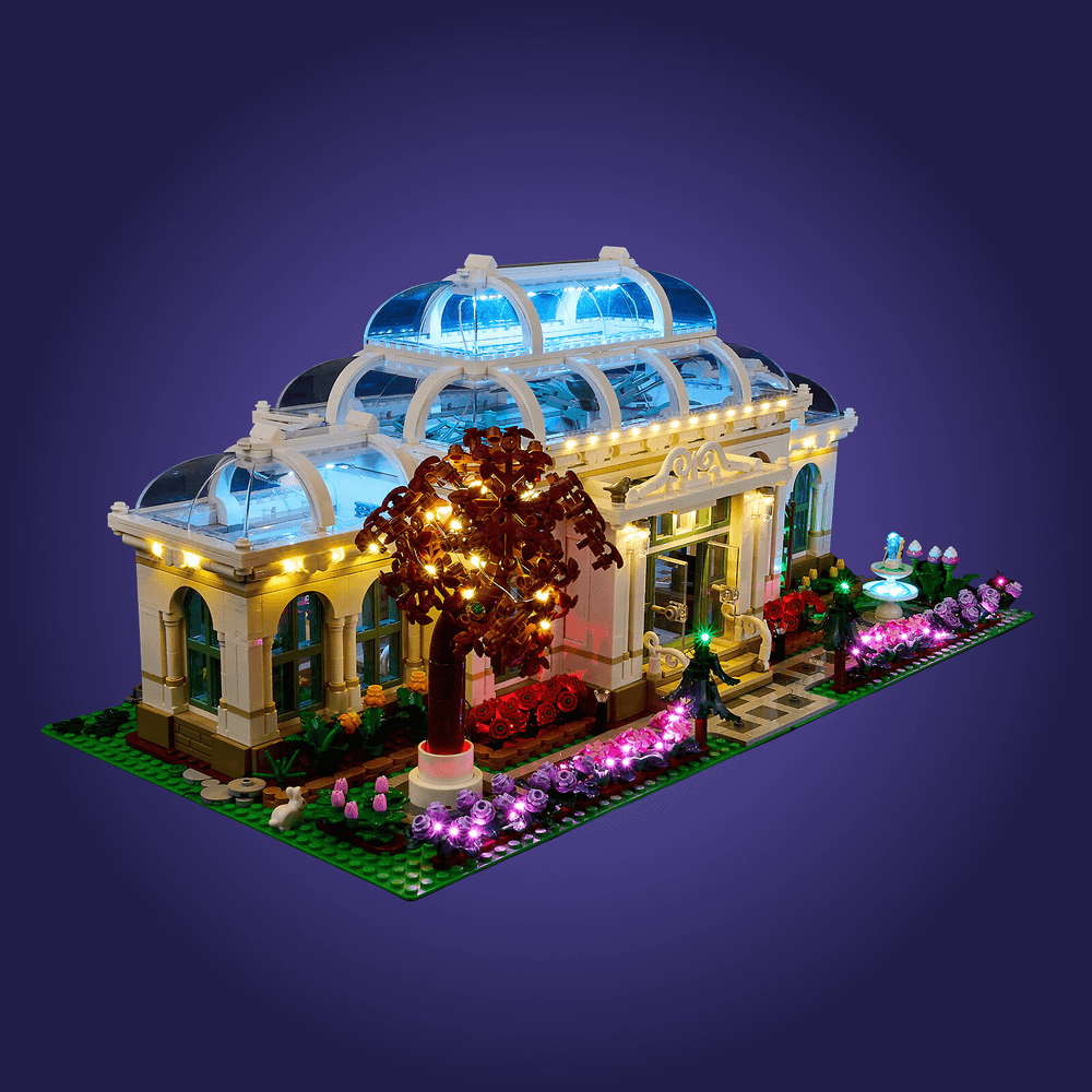 Detailed LEGO set of a building 21353 with illuminated features on a dark purple background