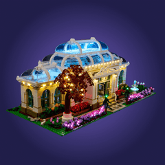 Detailed LEGO set of a building 21353 with illuminated features on a dark purple background