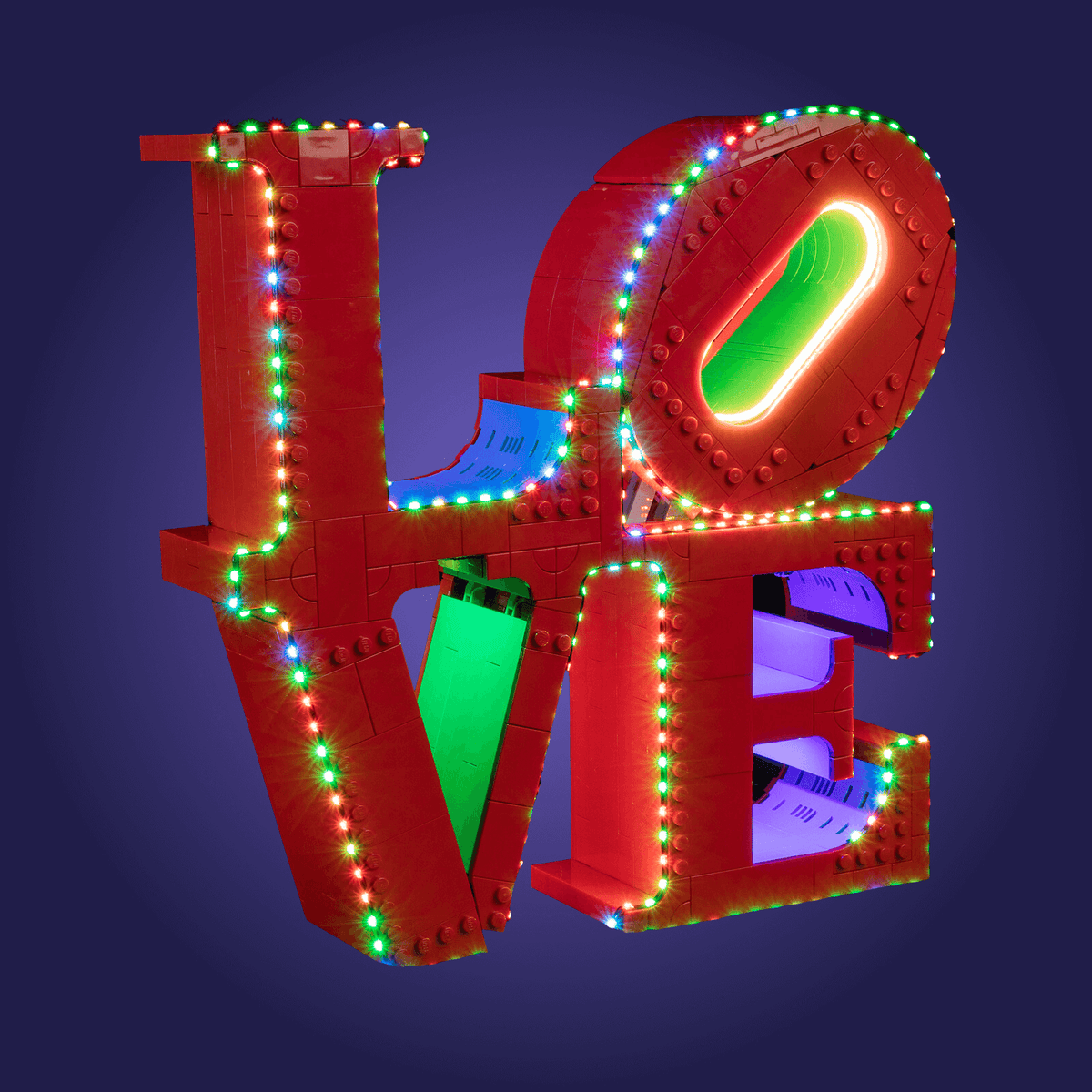 Colorful Lego 'LOVE' 31214 sculpture with illuminated lights on a dark background