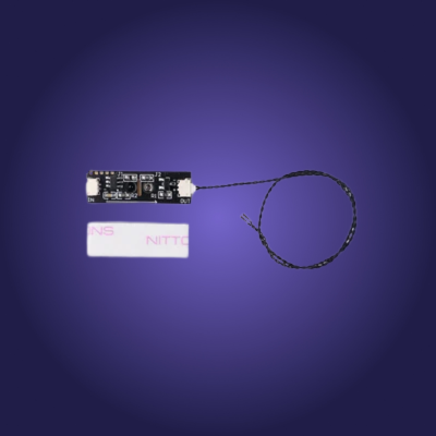 Electronic component with a cable on a reflective purple surface