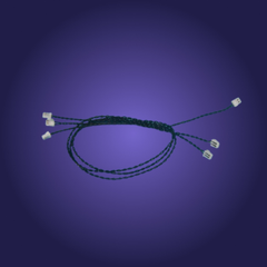 Braided green cord with white connectors on a purple background