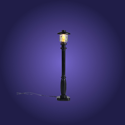 Black outdoor lamp post with a lit lantern on a dark blue background
