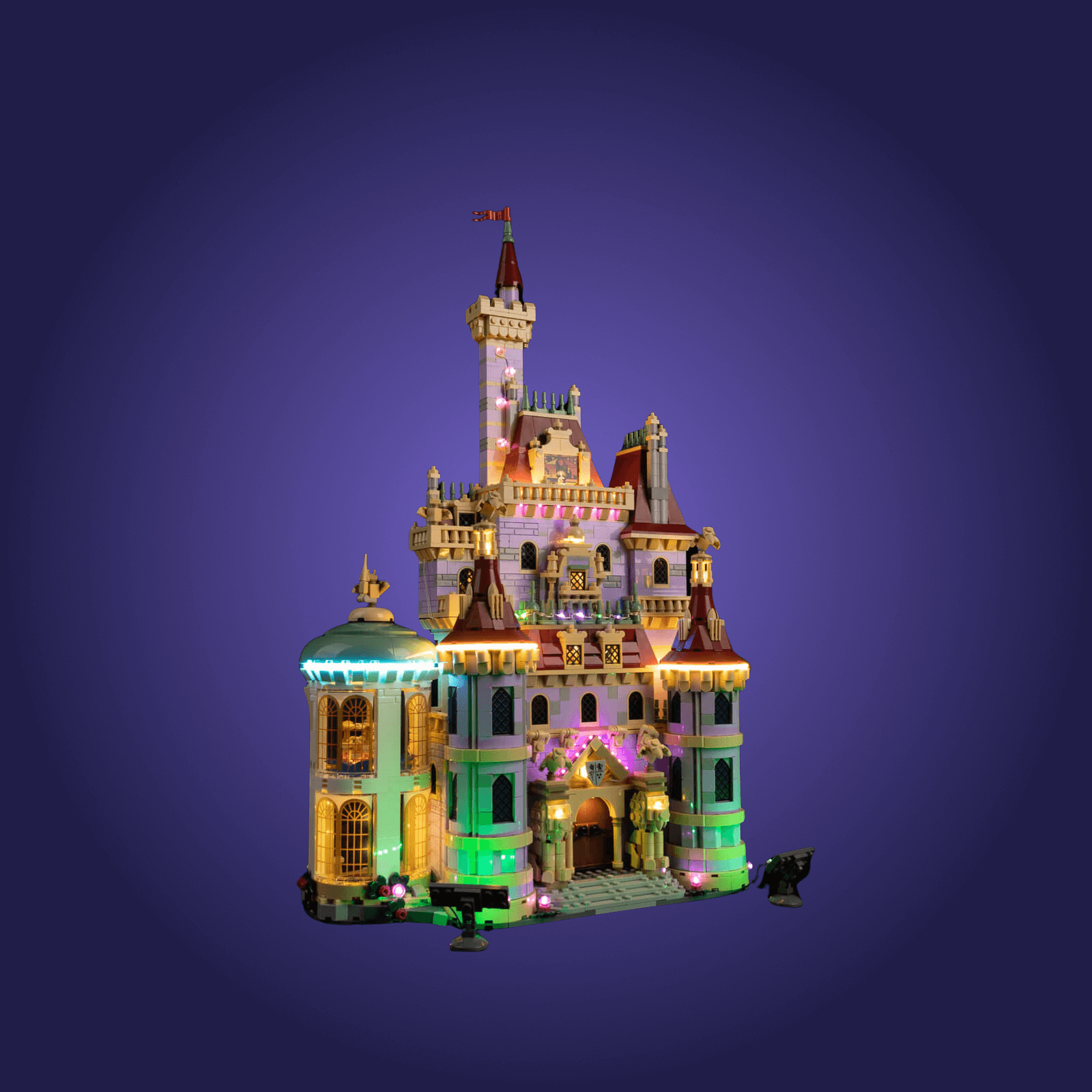 Colorful castle model with illuminated details on a dark blue background