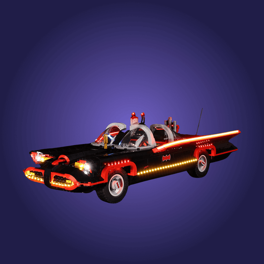 Toy Batmobile with illuminated details on a dark blue background